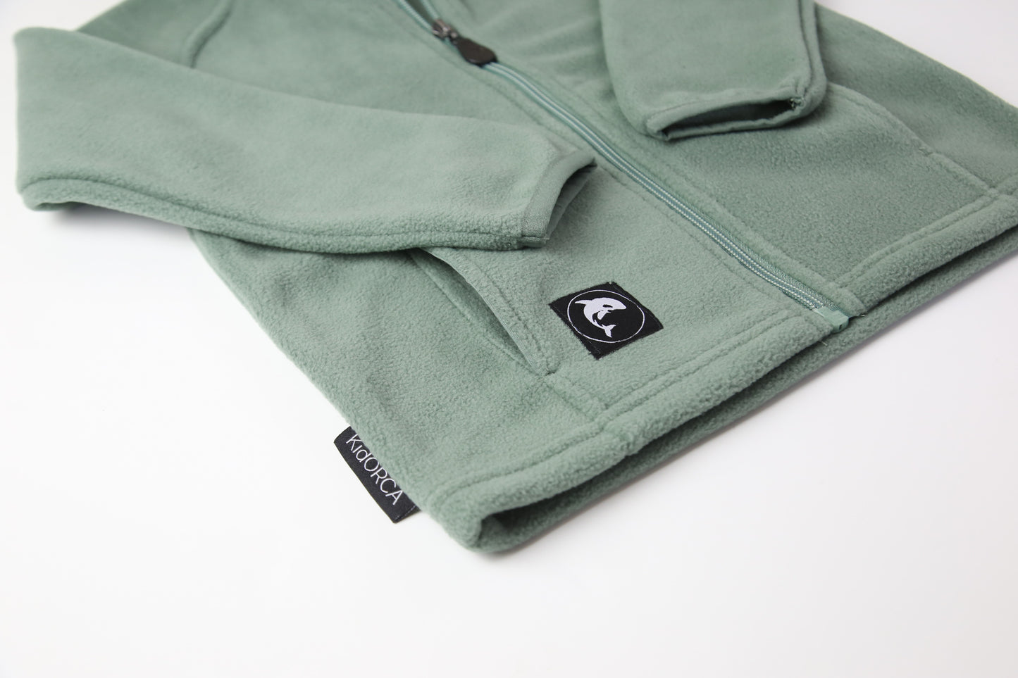 Close-up of soft fleece fabric – olive kids jacket