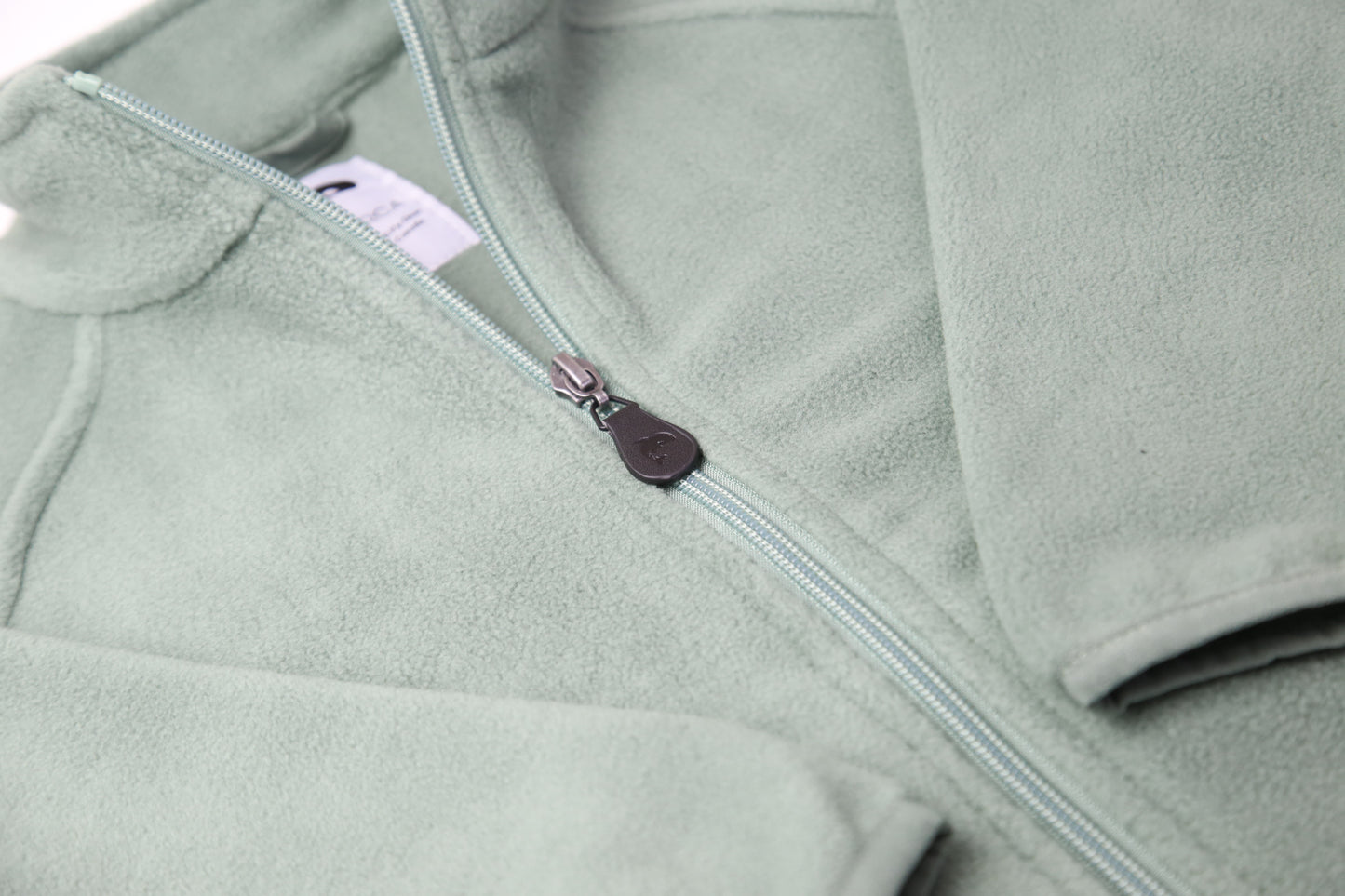 Close-up of soft fleece fabric – olive kids jacket