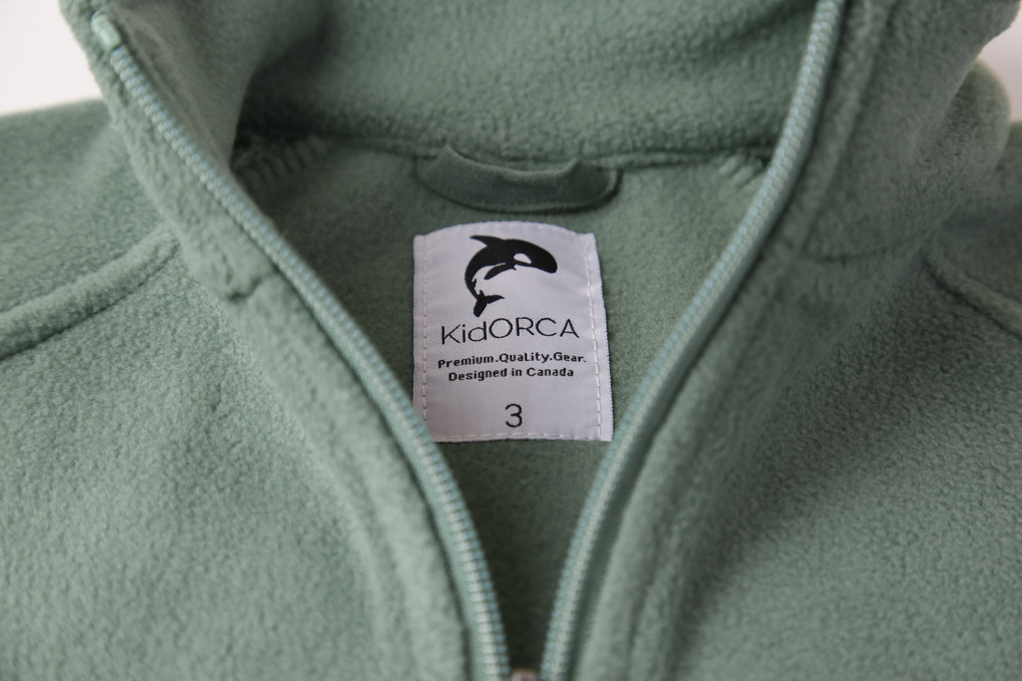 Close-up of soft fleece fabric – olive kids jacket