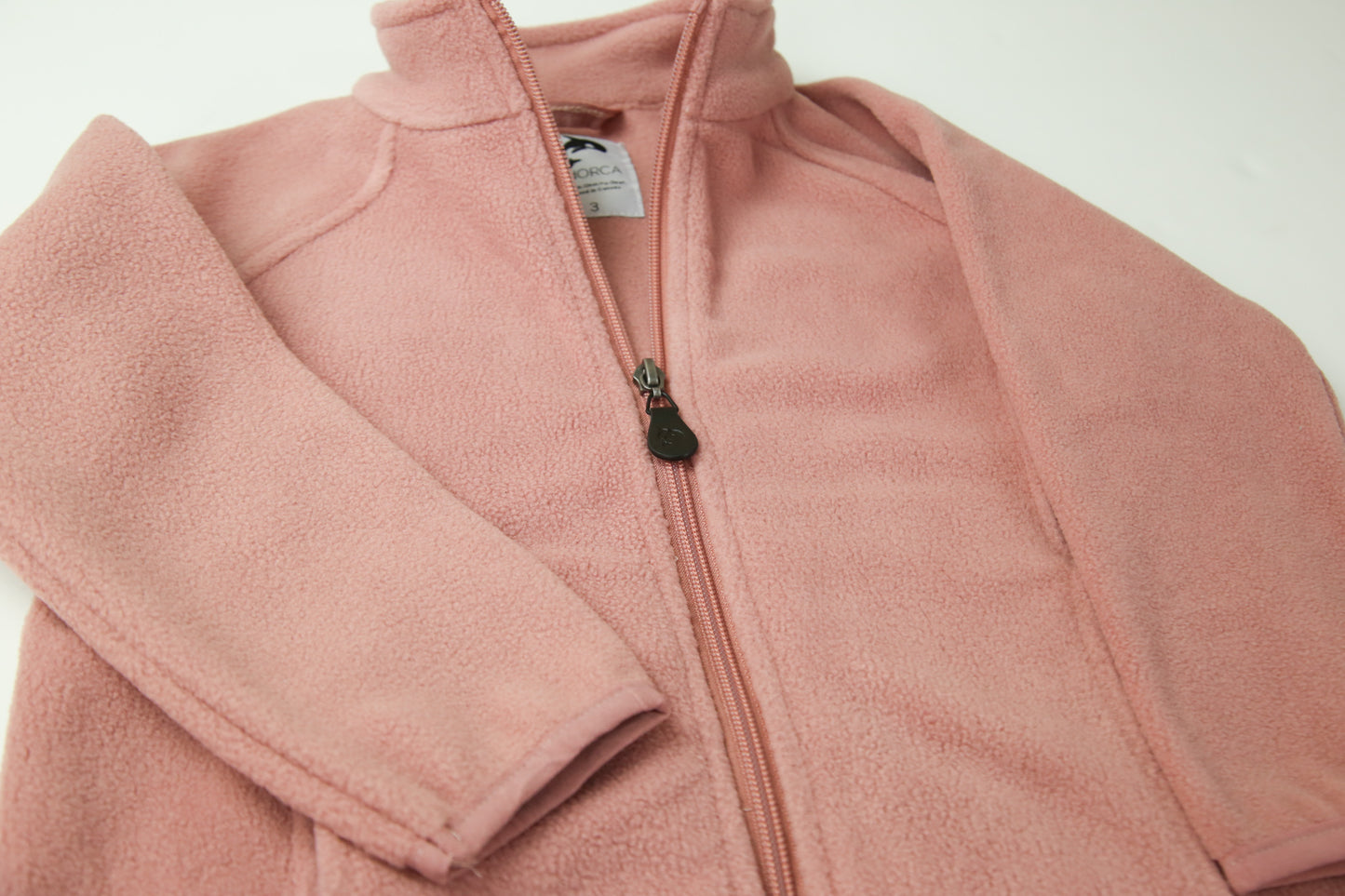 Close-up of soft fleece fabric – ash-rose kids jacket