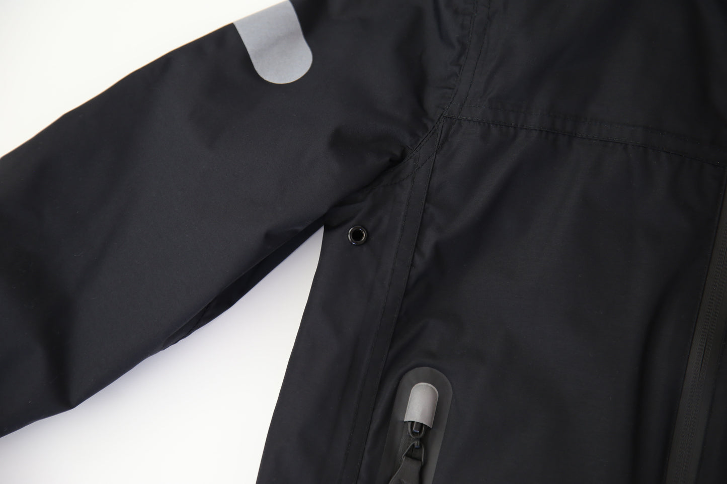 Taped seams and waterproof zipper detail – black insulated jacket