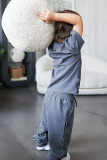 Kid playing in fjord blue organic cotton tee by KidORCA