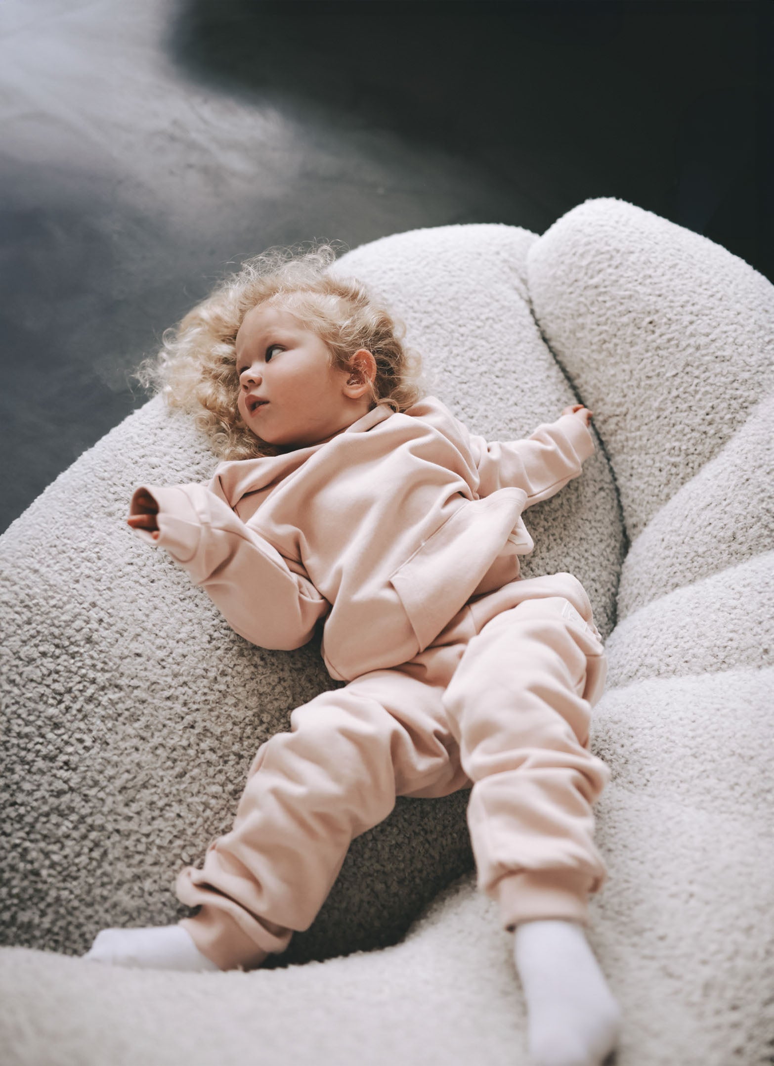 Kid playing in pale rose french terry hoodie by KidORCA