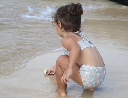 Girl wearing Evangelina sage swim bottom – side view