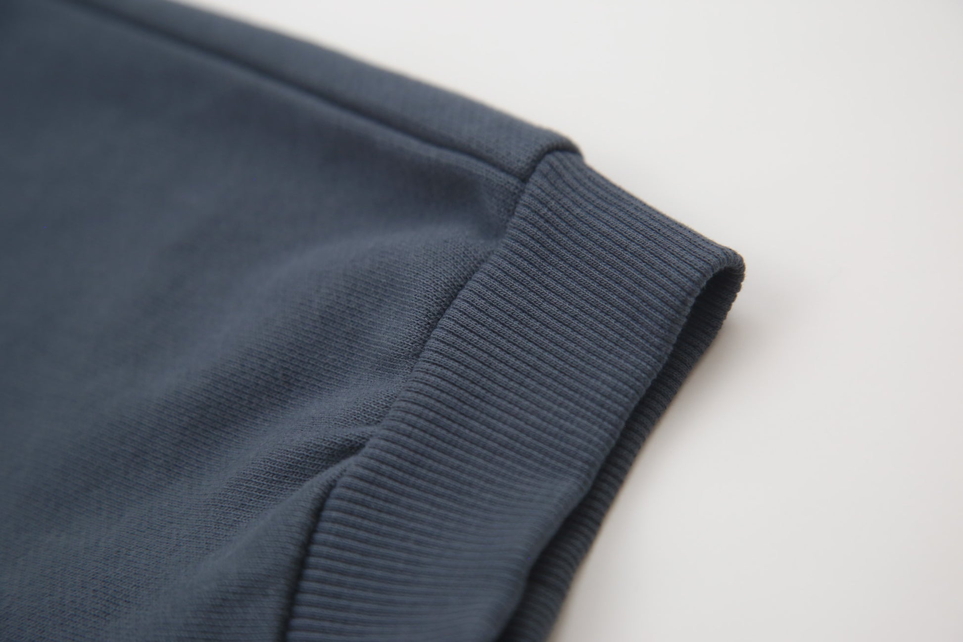 Close-up of organic french terry fabric texture – fjord blue kids sweatpants