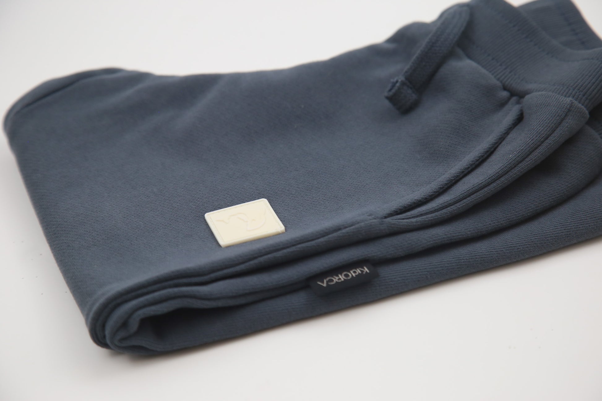 Rib cuff and side pocket detail on fjord blue french terry kids sweatpants