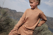 Kid playing in sandstone french terry shorts by KidORCA