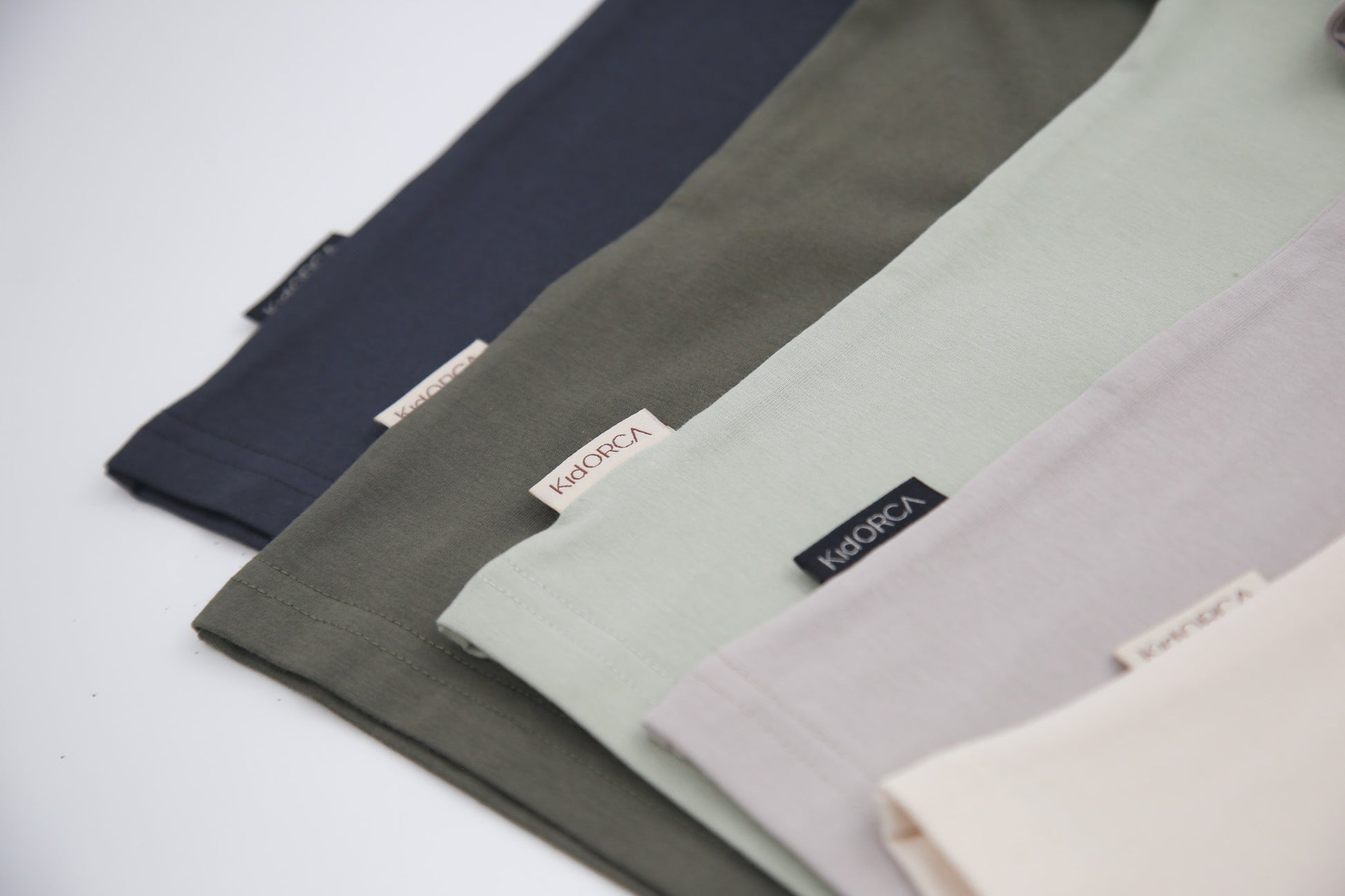Close-up of organic cotton fabric texture – sage kids tee