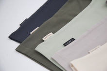 Close-up of organic cotton fabric texture – sage kids tee
