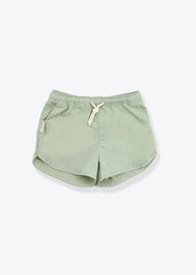 Girls swim trunks in sage green – front view