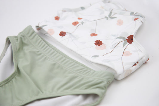 Elastic waistband detail on sage green swim bottom