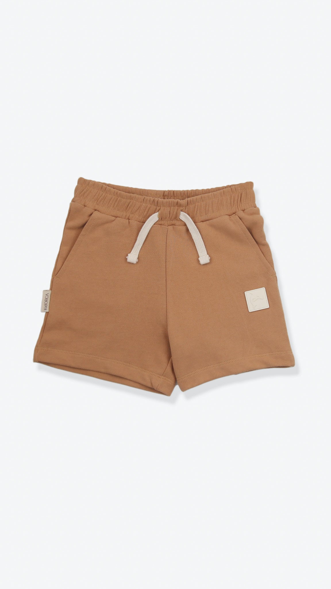 Organic french terry kids shorts in sandstone beige – front view