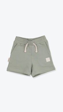 Organic french terry kids shorts in sage green – front view
