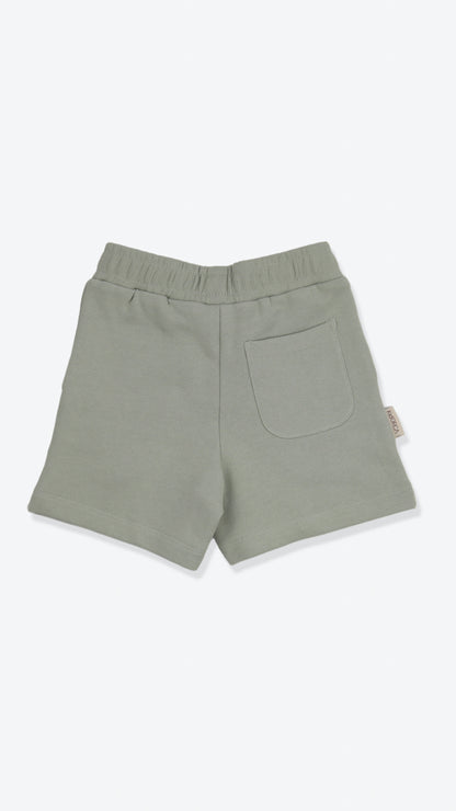 Organic french terry kids shorts in sage green – back view