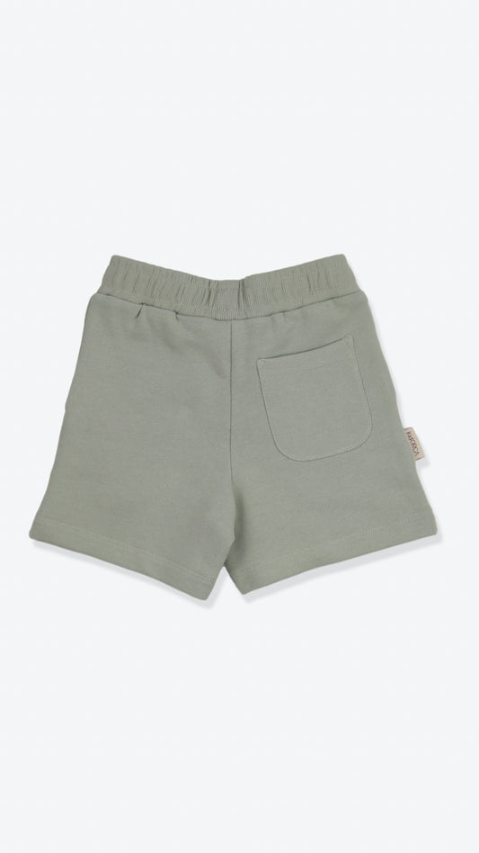 Organic french terry kids shorts in sage green – back view
