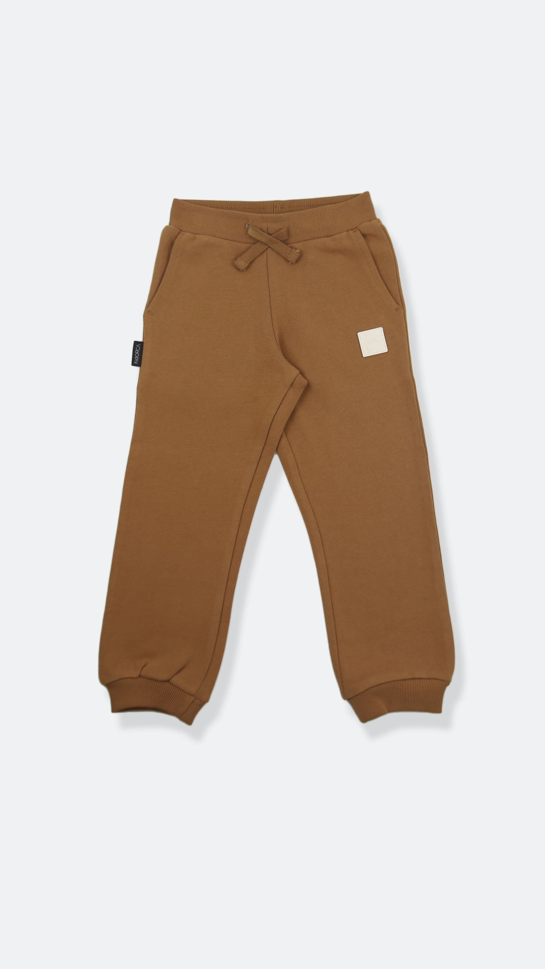 Organic french terry kids sweatpants in ginger color – front view
