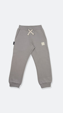 Organic french terry kids sweatpants in pebble grey – front view