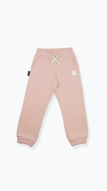 Organic french terry kids sweatpants in pale rose – front view