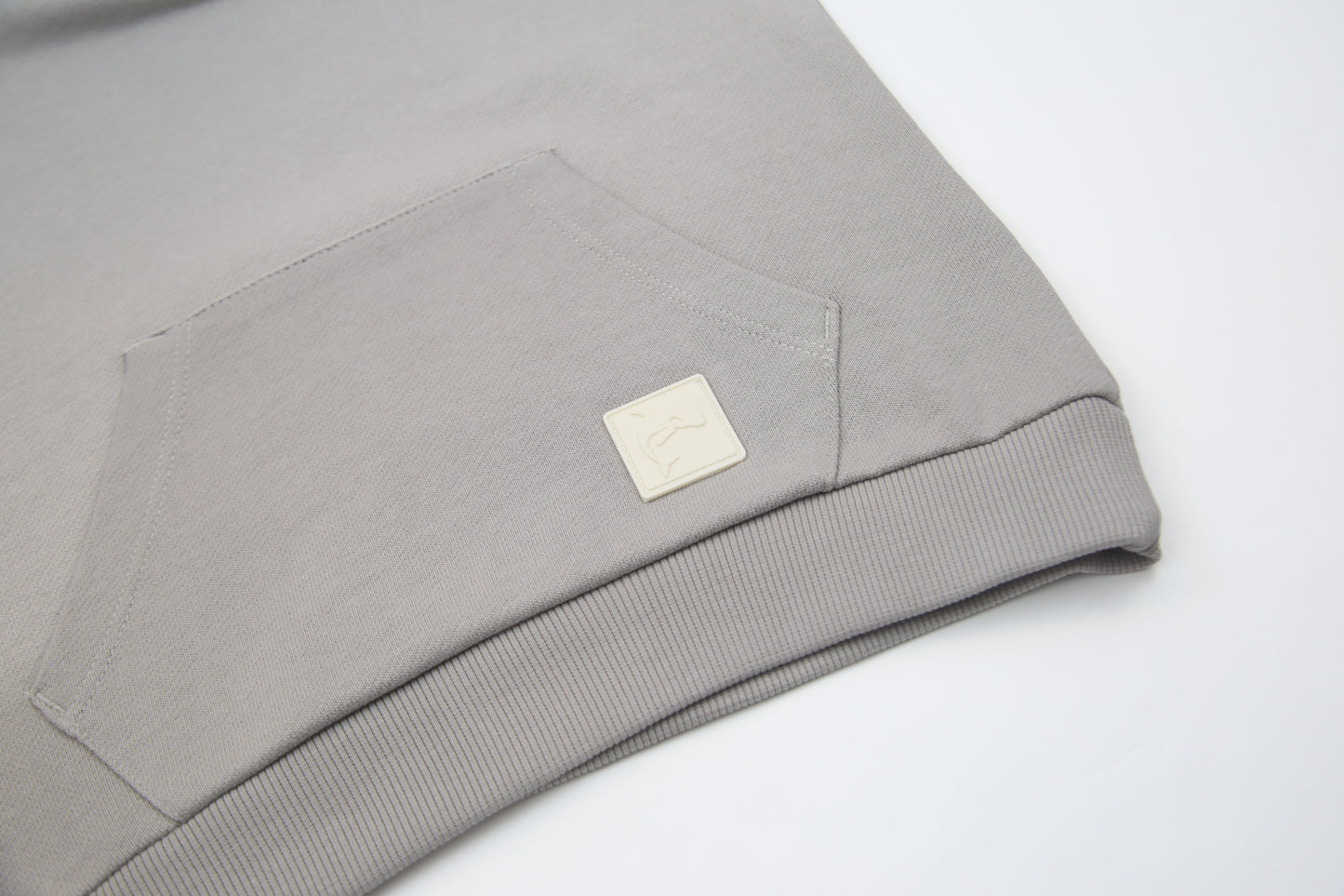 Kangaroo pocket and rib cuff detail on pebble french terry kids hoodie