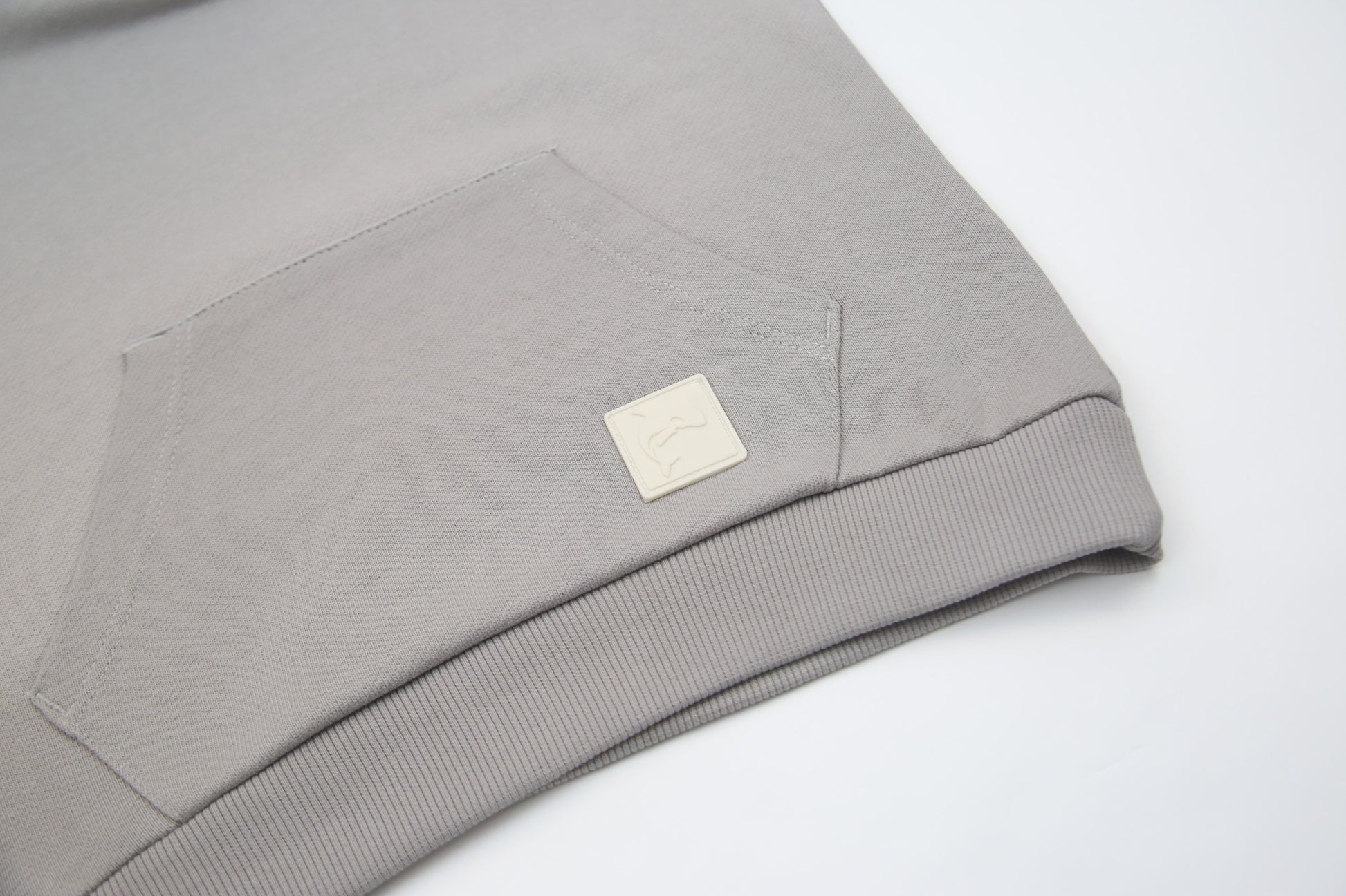 Kangaroo pocket and rib cuff detail on pebble french terry kids hoodie