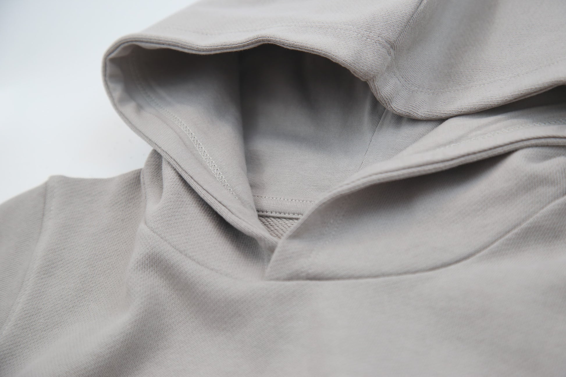 Close-up of french terry fabric and hood detail – pebble kids hoodie
