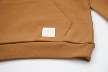 Kangaroo pocket and rib cuff detail on ginger french terry kids hoodie