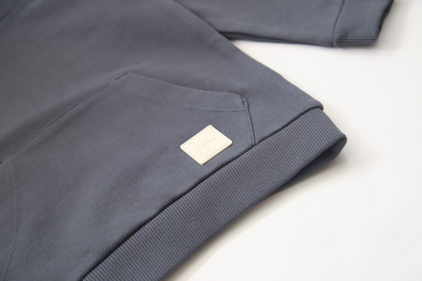 Kangaroo pocket and rib cuff detail on fjord french terry kids hoodie