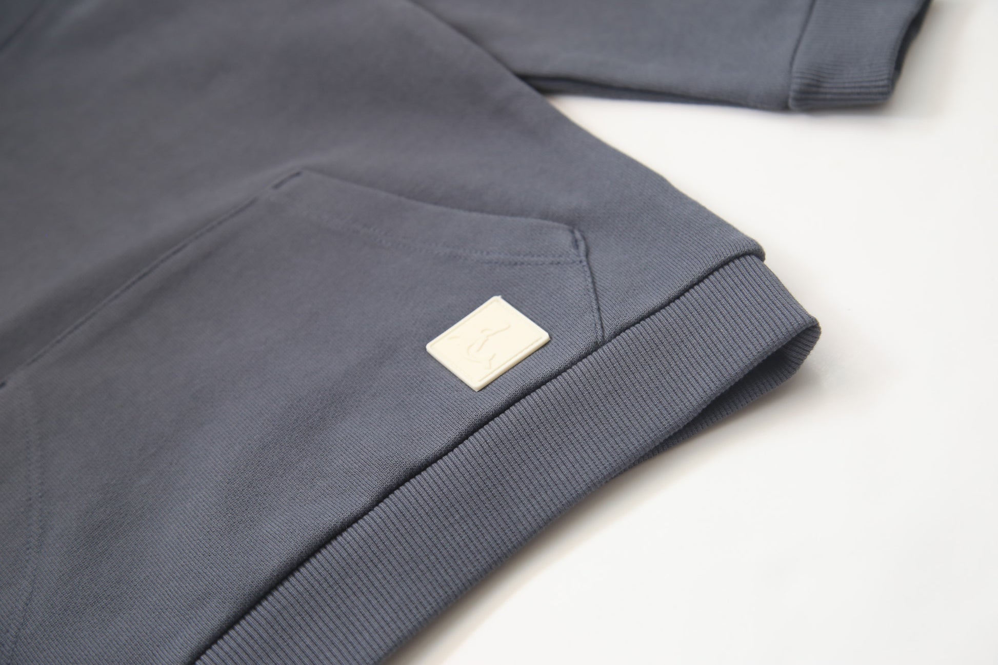 Kangaroo pocket and rib cuff detail on fjord french terry kids hoodie