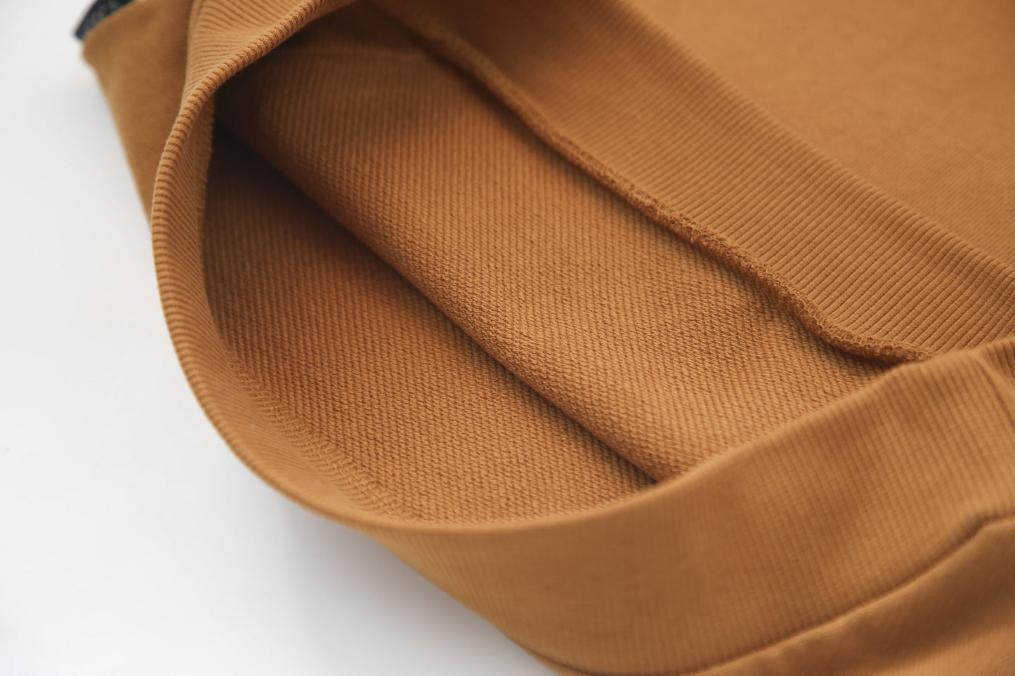 Close-up of french terry fabric and hood detail – ginger kids hoodie